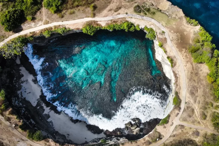 A beautiful view of the beach in Bali with clear blue water, perfect for a family vacation.