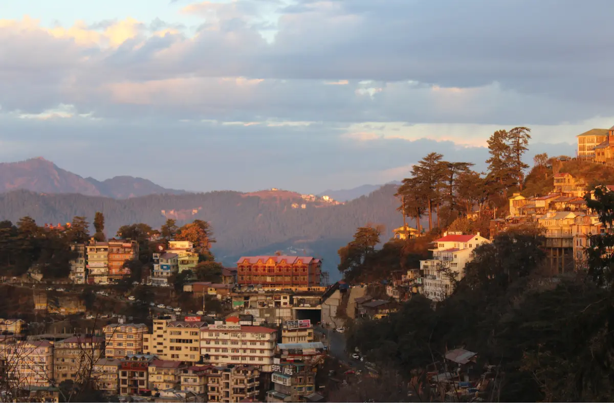 Experience the stunning views of local houses and hills in Shimla.